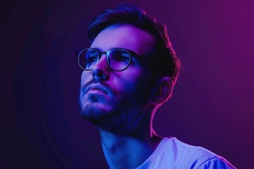 Fototapeta premium Serious successful man in glasses against neon purple background.