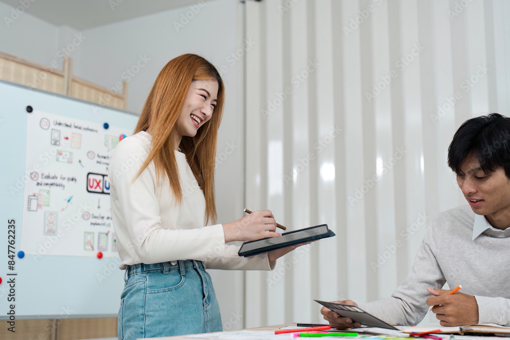 Wall mural creative team collaboration on ux ui design project in modern office environment with whiteboard and