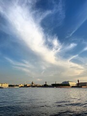 city river view, river in the city center, blue sky, white clouds, summer