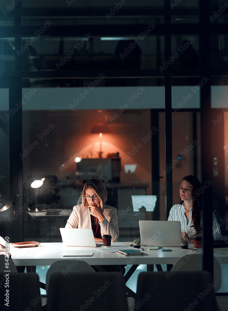 Poster Night, glass and business women with laptop in office for thinking, collaboration and creative solution. Working late, research and website design team with pc for online, planning or problem solving