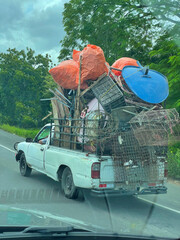 POV: Passenger view of a loaded pick-up truck driving along the Panam Highway