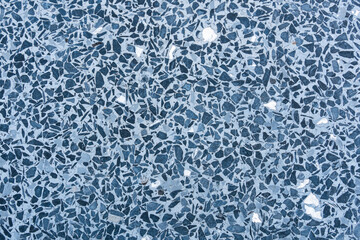 Top view of blue terrazzo floor pattern background. Blue polished concrete floor decorated with granite stone.
