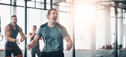 Exercise, man and scream to celebrate achievement in workout class, fitness and training goals. Sports, people and motivation for power challenge, winner or performance success at health club or gym