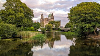 Obraz premium Galway cathedral reflected in the Corrib river in Galway city, Ireland, Irish landmark, buildings and architecture 