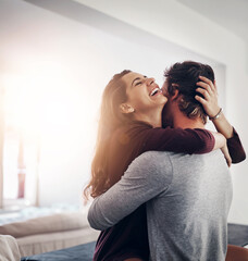 Couple, hug and laughing in home kitchen with love, bonding and smile together with joy. Embrace,...