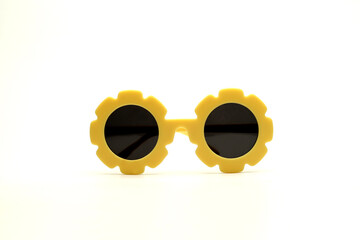 yellow flower-shaped sunglasses on a white background