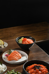 Assorted traditional Japanese food dishes on rustic wood background