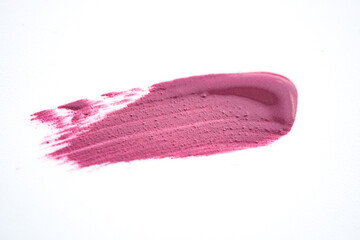Fototapeta premium Pink shimmering lipstick texture stroke isolated on white background. Cosmetic product swatch