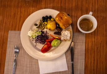 Moroccan hotel breakfast also known as ftour, msemen, coffee, fruits, harcha, mint tea, bread