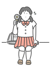 ハンディ扇風機　ハンディファンを使用する制服姿の女子