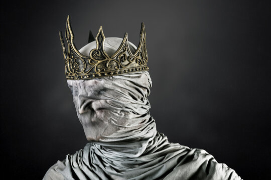 Ghost of a queen or king over dark misty background