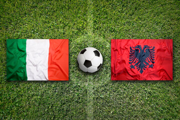 Italy vs. Albania flags on soccer field © BirgitKorber