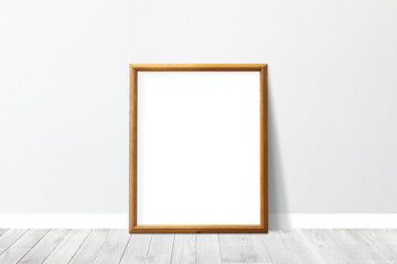 Wooden picture frame mockup leaning against a gray wall