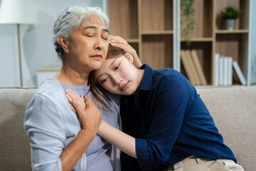 Grandmother embraces granddaughter with love and care.