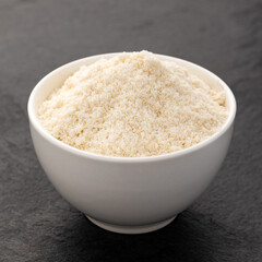 Organic gelatin powder also called hydrolyzed collagen - White powder in the bowl