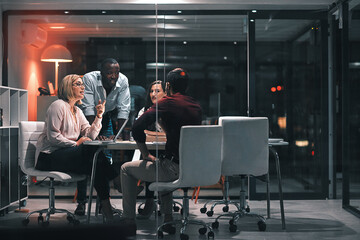 Business meeting, laptop and people for design at night in office, creative agency and overtime food for project. Teamwork, support and problem solving in pizza planning for deadline and discussion