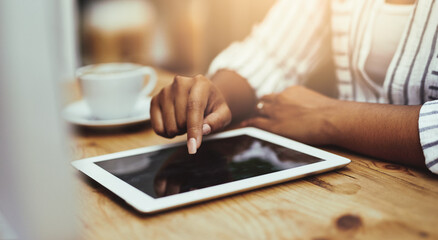 Woman, tablet and typing in coffee shop for social media post, communication or online news and email. Female person, technology and writing message for internet research, web browsing or networking