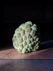 Serikaya or Annona squamosa is a tropical fruit with scaly skin. It tastes sweet