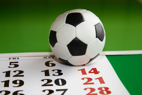 Soccer ball on a green background and a calendar with the date July 14, final match, UEFA European Championship, sports calendar, soccer ball and calendar, championship game schedule
