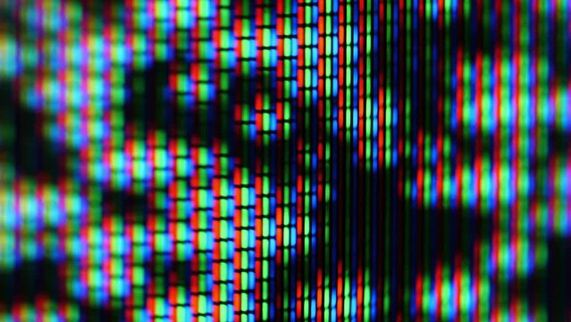 Close-up of an analog TV screen red, green, and blue pixels that combine to