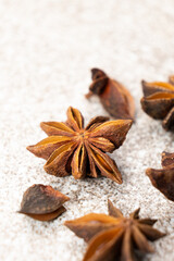 Spice star anise closeup on gray stone background