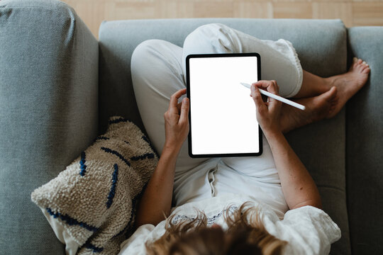 Digital tablet png mockup, woman working from home transparent design - Powered by Adobe