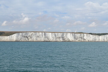 The majestic white cliffs of Dover as seen from a ship sailing near the English coast