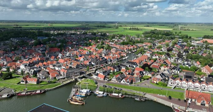 Historic city center of Makkum along the water, Friesland, The Netherlands. Aerial view.