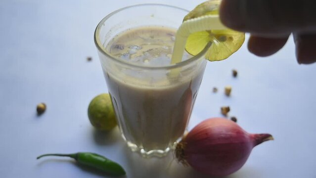 Sattu Sharbat. It is a popular drink in India at summer season. Its mad from roasted Bengal Gram flour. It is prepared by mixing sattu with water, salt, onion, mint, coriander leaves.Slow motion video