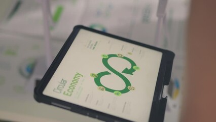 The team, comprising engineers and business professionals, discusses data analysis, renewable energy, and strategies for reducing the carbon footprint. - Powered by Adobe