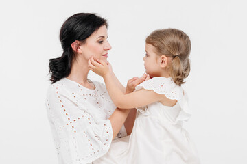 Close-up of tender touches and sensitive moment between mother and daughter.