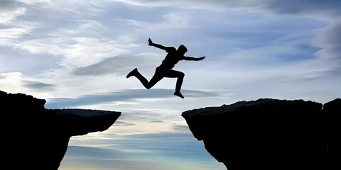 The silhouette of a man jumping from one cliff to another, symbolizes life challenges and personal growth, overcoming obstacles and achieving success