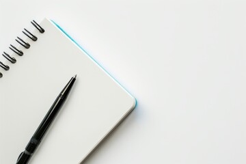 A Blank Page Awaits: A Pen Ready For Inspiration On A White Surface