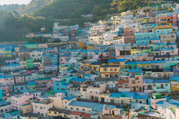 the vibrant and picturesque urban landscape of Gamcheon Culture Village, Busan, Korea, featuring a...