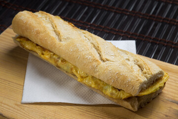 Homemade bread sandwich with zucchini tortilla with chives.