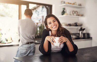 Coffee, happy and portrait of woman in kitchen with boyfriend at home in morning on weekend together. Smile, love and female person drinking latte, cappuccino or caffeine at apartment in Canada.