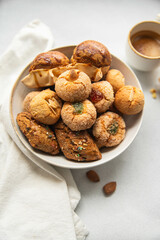 Variety of homemade Italian sweets typical for Sardinia region. Pardulas, amaretti, papassine and...