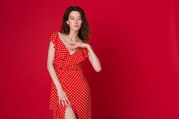 stylish woman in summer fashion trend dress on red background