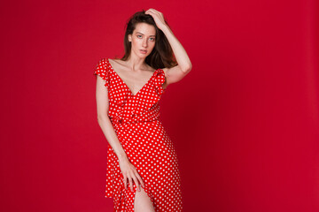 stylish woman in summer fashion trend dress on red background