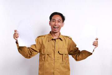 Successful Indonesian government employees standing while holding a document or paper. Isolated on...
