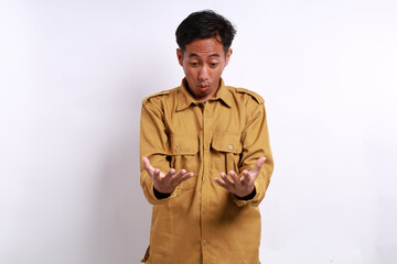 Wow and surprised expression of Indonesian government employees standing while holding something