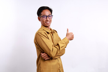 Happy Indonesian government employees standing while showing thumbs up. Isolated on white background