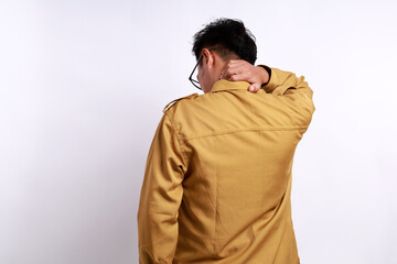 Back view of Tired Indonesian government employees suffering from neck and back pain