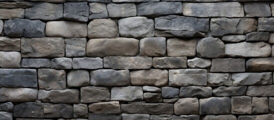 Fototapeta premium Texture of a stone wall Old castle stone wall texture background Stone wall as an abstract background or texture Part of a stone wall for background or texture. Creative banner. Copyspace image