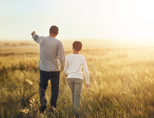 Back, field and father with son, walking and adventure with sunshine, getaway trip and bonding...