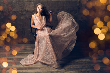 beautiful woman in evening dress sitting in chair, luxury glamour style
