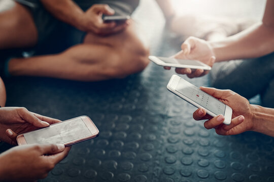 People, hands and calendar with phone for schedule workout, communication or data sync at gym. Closeup of group on mobile smartphone for training day, exercise routine or fitness date at health club