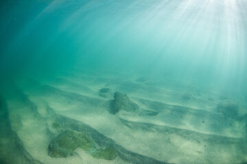 Sandy ocean floor with beautiful sunlight.