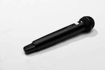 Close-up the wireless microphone for speaker speech presentation stage performance with white background.