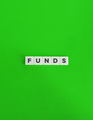 Word Funds. Collective Investments. Text on Block Letter Tiles on Yellow Background. Minimalist Aesthetics.